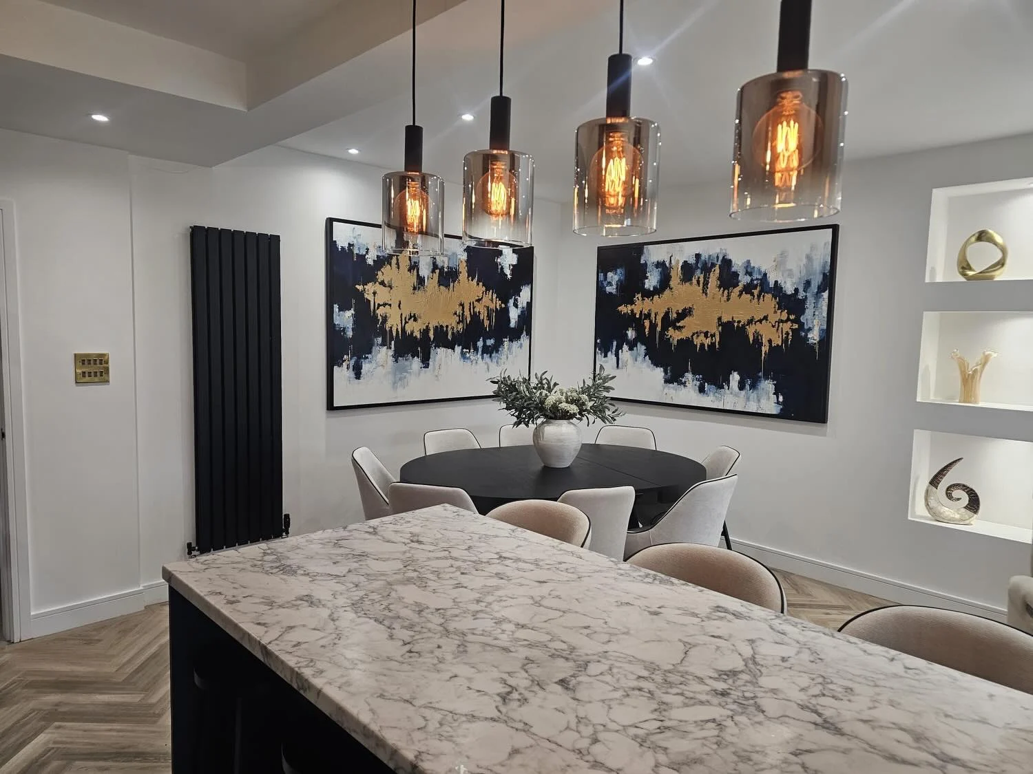 The same dining room with the two paintings on the wall